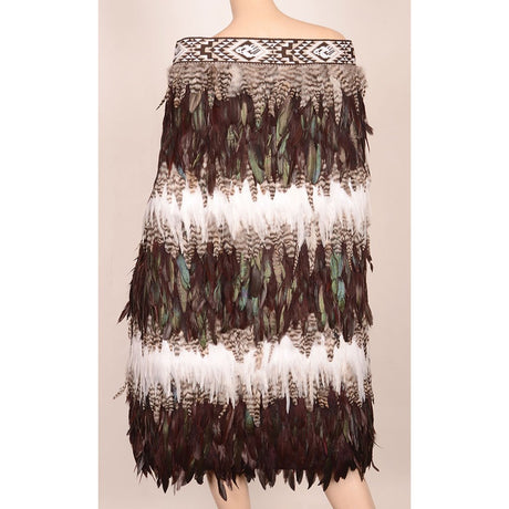 Stunning Maori cloak inspired by Tane Mahuta, featuring vibrant feathers and taniko trim, ideal for special occasions.