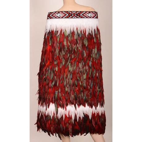 A beautifully handcrafted Korowai cloak adorned with vibrant Pohutukawa flower designs, symbolizing M?ori heritage and unity.