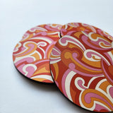 Retro Koru Printed Coaster (10cm) with vibrant design, thick MDF and cork base for heat protection and non-slip use.