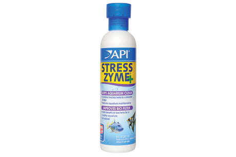 Bottle of API Stress Zyme 237mL designed to reduce ammonia and nitrite, promoting a healthy aquarium with live bacteria.