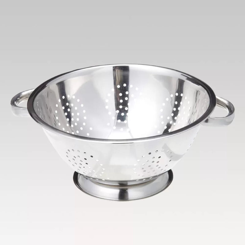 Elegant 24 cm stainless steel Wiltshire colander with sturdy handles, ideal for rinsing and draining food efficiently.