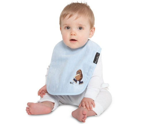 Kiwiana Wonder Bib in Baby Blue features a playful Kiwi design, super-absorbent cotton, and water-resistant backing for stylish protection.