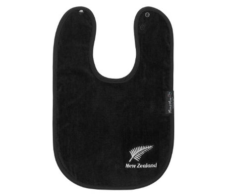 Kiwiana Wonder Bib in Black Fern features a stylish design, super-absorbent cotton, and water-resistant backing for baby comfort.