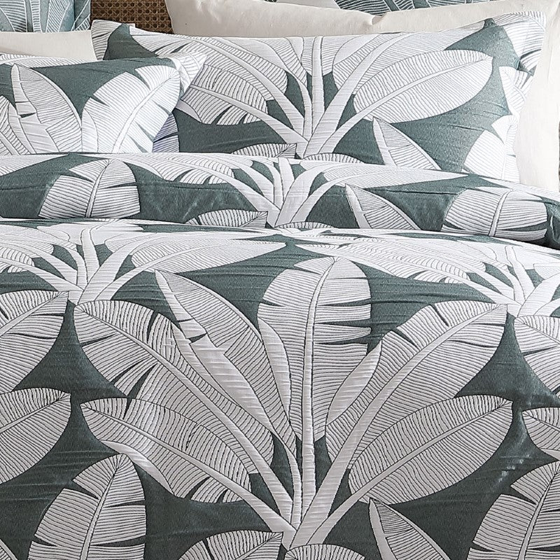 Super King duvet cover set in Lagos Olive featuring oversized white banana leaves on a lush olive background for tropical elegance.