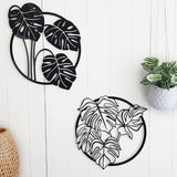 Large white ACM circle wall art featuring a detailed monstera deliciosa leaf, ideal for indoor and outdoor decoration.