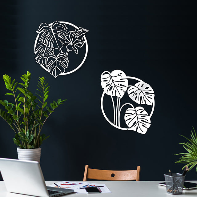 Artistic white ACM circle wall art featuring a monstera leaf design, ideal for indoor or outdoor decor.