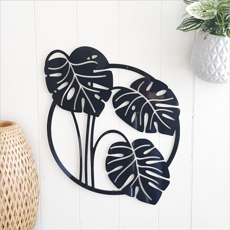 White wall art featuring a large, elegant Monstera deliciosa leaf, perfect for indoor or outdoor decor.