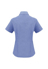 Ladies Mid Blue short sleeve shirt, size 22, in breathable polyester with UPF, featuring an open neckline and curved hem.