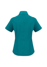 Teal short sleeve shirt for women, size 18, made from breathable polyester with UPF sun protection and stylish curved hem.