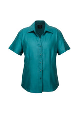 Teal short sleeve shirt in size 18, featuring breathable fabric, chic open neckline, and curved hem for stylish summer wear.