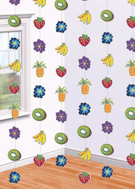 Vibrant Cabana/Rio theme decorations featuring colorful fruit and flower strands, perfect for tropical party settings.