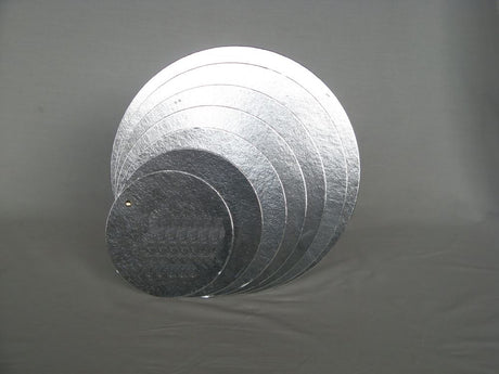 Clearance set of 10 durable 4" silver foil-lined cake boards for elegant presentation of cakes and desserts.