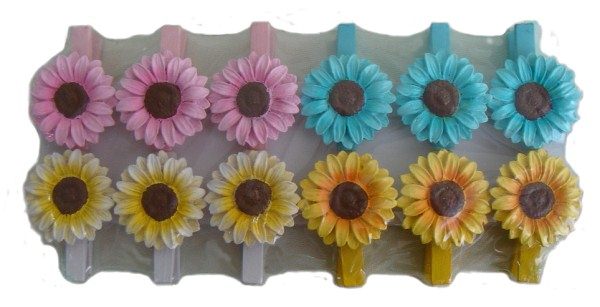 Set of 12 vibrant wooden flower pegs in yellow, white, blue, and pink, perfect for crafts and party decor.