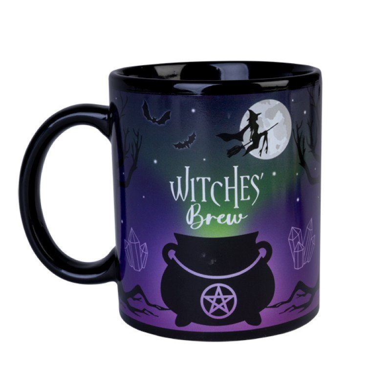 Ceramic coffee mug with a witches cauldron and eerie night sky, perfect for enchanting brews and festive decor.