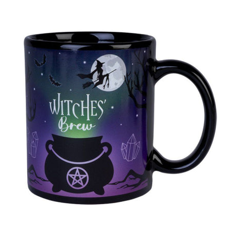 Ceramic coffee mug featuring a witches cauldron under a night sky, perfect for magical brews and decorative charm.