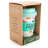 Bamboo travel cup featuring dachshund pattern, aqua lid, and silicone band with humorous phrase, holds 470ml.