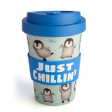 Eco to Go Bamboo Cup featuring playful penguins design, 470 ml capacity, blue lid, and 'Just Chillin' silicone band.