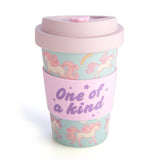 Eco-friendly bamboo travel cup featuring unicorns and rainbows, complete with a pink anti-spill lid and silicone band.