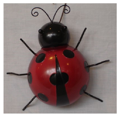 Large metal wall art of a ladybug, vibrant and colorful, perfect for adding character to any space.