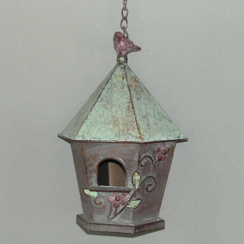 Cylindrical brown birdhouse, 58cm tall, designed for nesting birds, enhances garden decor and attracts various bird species.