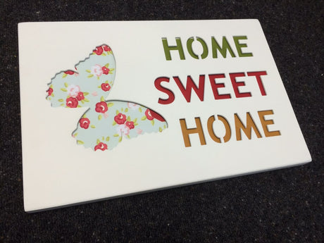 3D wooden wall art featuring "Home Sweet Home" quote, perfect for adding warmth to any room's decor.