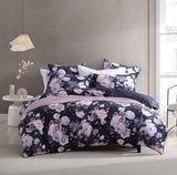 Super King duvet cover set in Macy Violet, featuring floral designs on soft velvet with deep violet reverse and black cord piping.