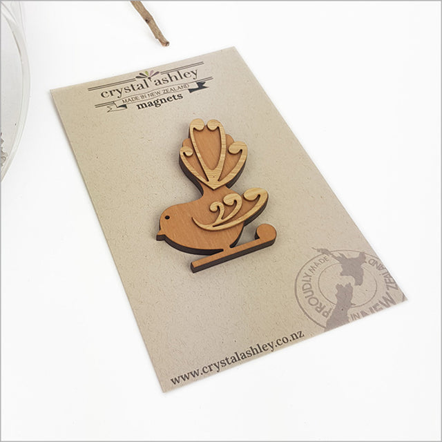 Kiwiana Moko Fantail magnet made from NZ Rimu and bamboo, showcasing a charming Kiwi Fantail silhouette, 65mm size.