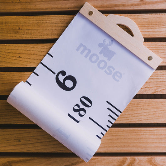 Moose Measure Me Height Chart for kids, made of durable canvas and wood, tracks growth milestones with added personalization.