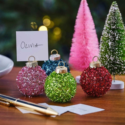 Colorful tinsel bauble place card holders for festive table settings, measuring 4cm, perfect for holiday gatherings.