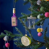 Whimsical tequila glass ornaments for Christmas tree decor, promoting festive cheer and sustainable design.