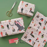 Merry & Bright Santa Baby Gift Wrapping Paper featuring colorful Christmas designs, includes 2 sheets and 4 festive gift tags.