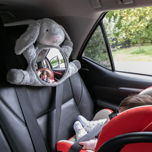 Baby in View Mirror - Moose Bunny, a shatter-proof car mirror for rear-facing seats, keeping infants entertained and safe.