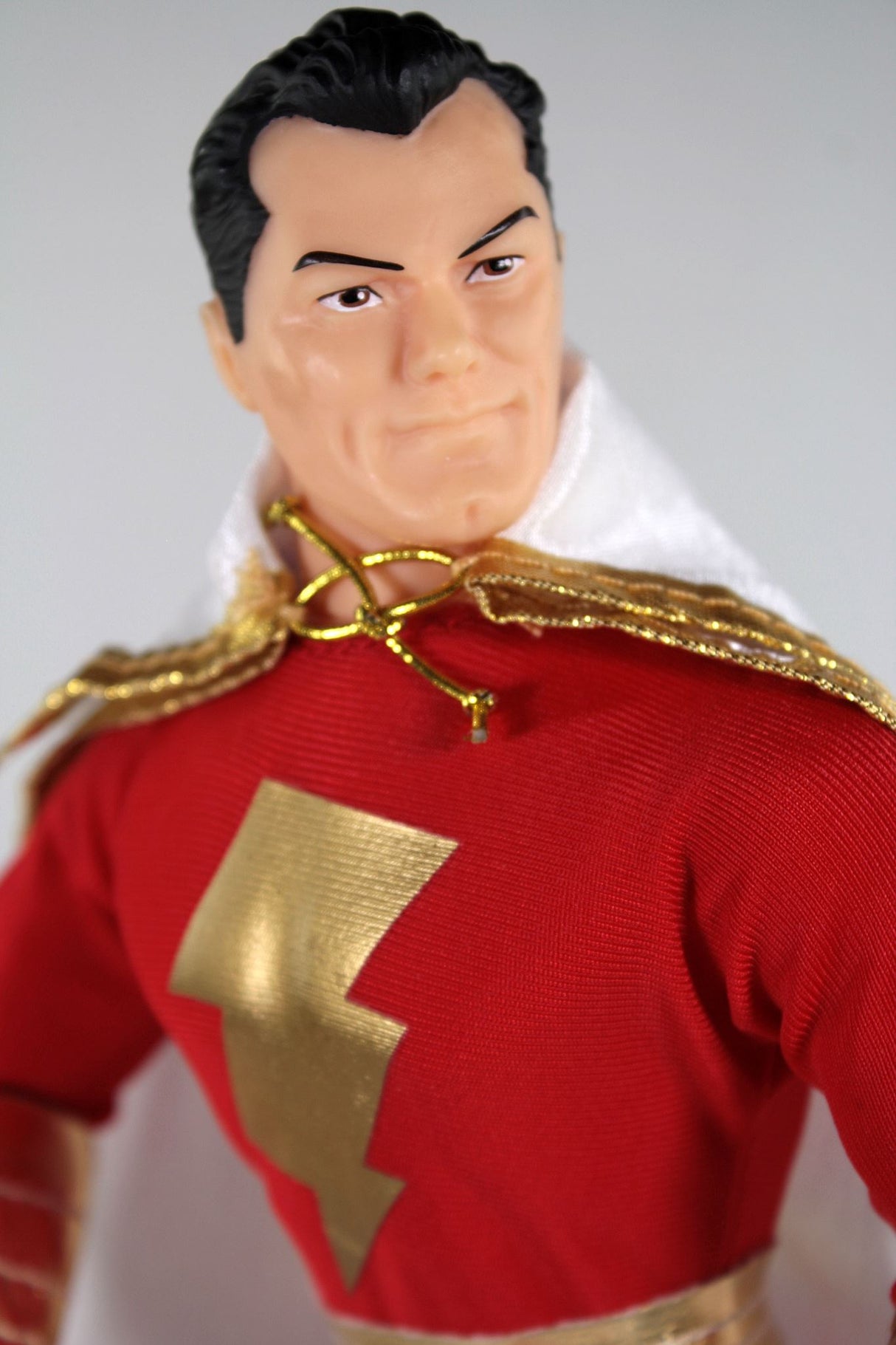 14-inch Mego Shazam collectible figurine with 14 points of articulation and comic book accurate details, perfect for fans.