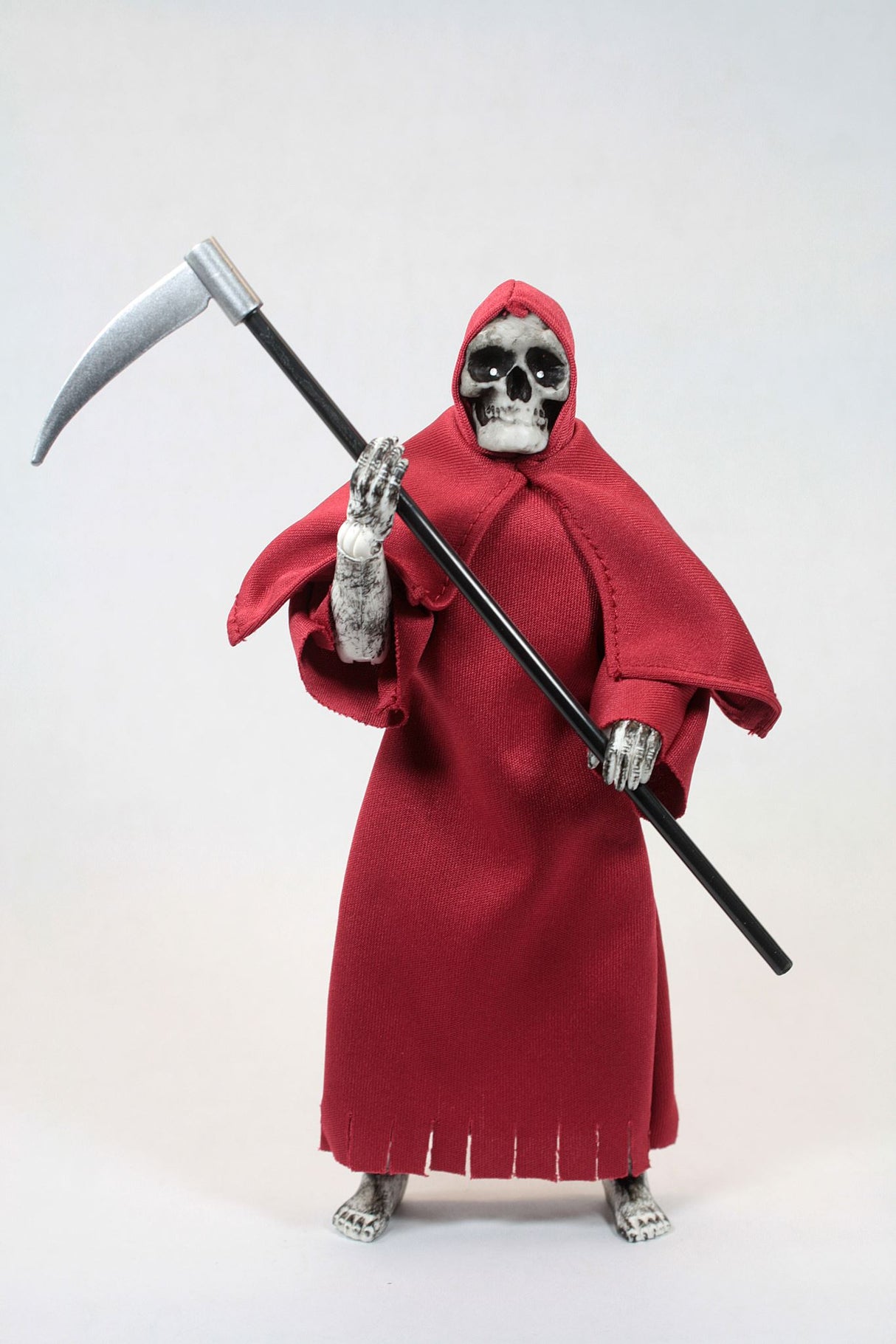 8-inch MEGO Grim Reaper figurine, featuring dark attire, scythe, and 14 points of articulation, perfect for collectors.