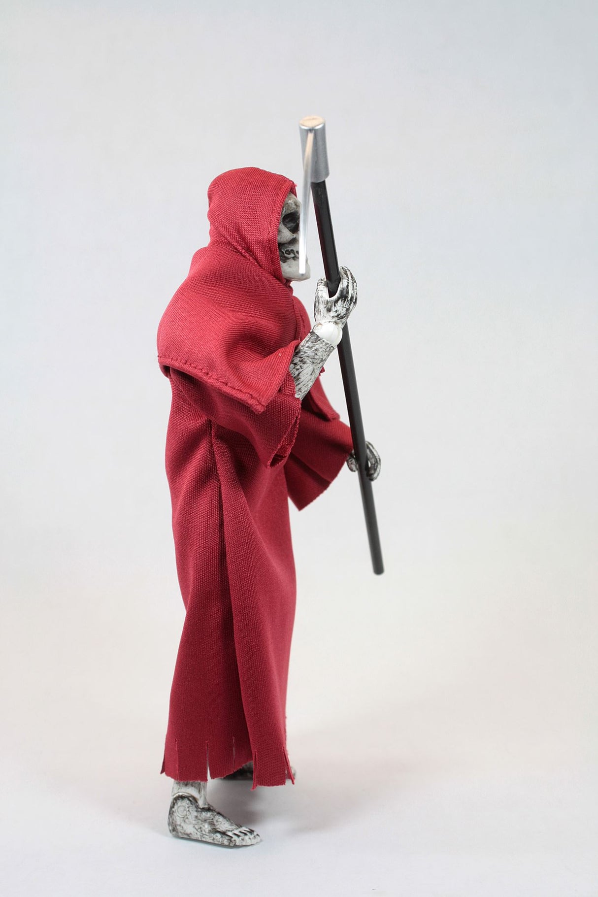 8-inch collectible Grim Reaper action figure with 14 points of articulation, dressed in dark attire, and holding a scythe.