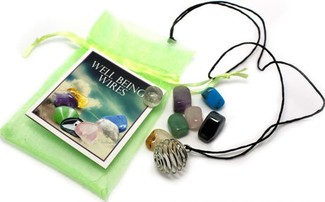 Well Being Pendants box featuring 36 assorted gemstone bags, each with changeable healing gemstones and informative cards.