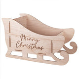 Whimsical wooden sleigh for holiday decor, measuring 48cm W x 28cm H x 25cm D, crafted from eco-friendly FSC certified wood.