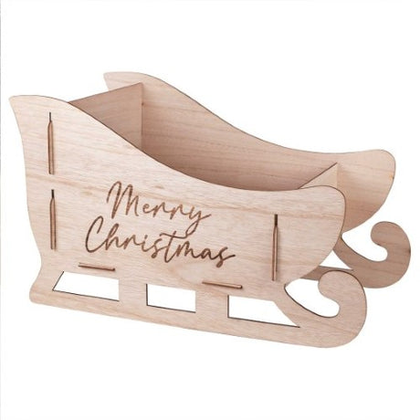 Whimsical wooden sleigh for holiday decor, measuring 48cm W x 28cm H x 25cm D, crafted from eco-friendly FSC certified wood.