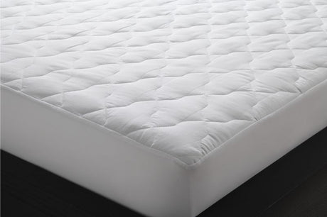 Quilted double mattress protector in white, featuring non-allergenic fill and fully fitted stretch walls for ultimate comfort.