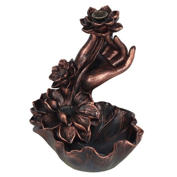 Elegant bronze backflow incense burner featuring a lotus and hand design, creating a serene waterfall smoke effect.