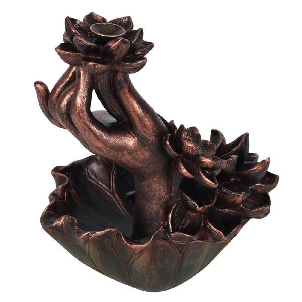 Intricate bronze backflow burner featuring a lotus and hand design, creating a mesmerizing smoke waterfall for relaxation.