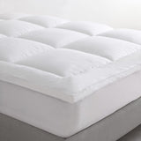 Plush Logan & Mason Pillowtop Mattress Topper for queen beds, featuring 1100gsm microfiber fill and breathable 300TC cotton cover.