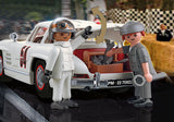Alt text: Playmobil Mercedes-Benz 300 SL model featuring gullwing doors, racecar driver figure, and detailed accessories for imaginative play.