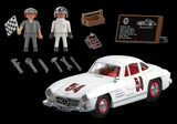 Playmobil Mercedes-Benz 300 SL model with gullwing doors, chrome bumpers, and accessories for imaginative racing play.