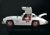 Playmobil Mercedes-Benz 300 SL model featuring iconic gullwing doors and detailed cockpit with driver and mechanic figures.