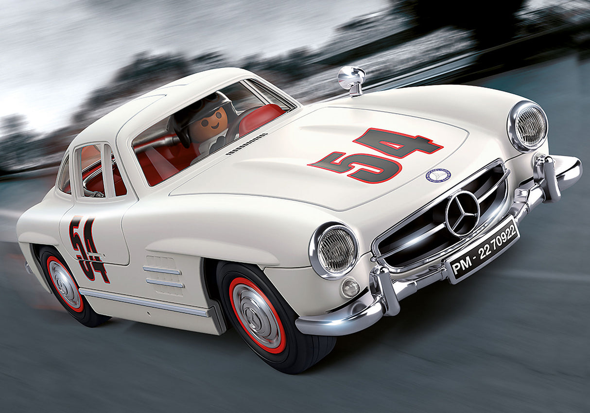 Playmobil Mercedes-Benz 300 SL model with gullwing doors, driver and mechanic figures, and racetrack accessories for imaginative play.
