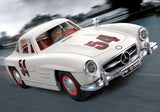 Playmobil Mercedes-Benz 300 SL model with gullwing doors, driver and mechanic figures, and racetrack accessories for imaginative play.