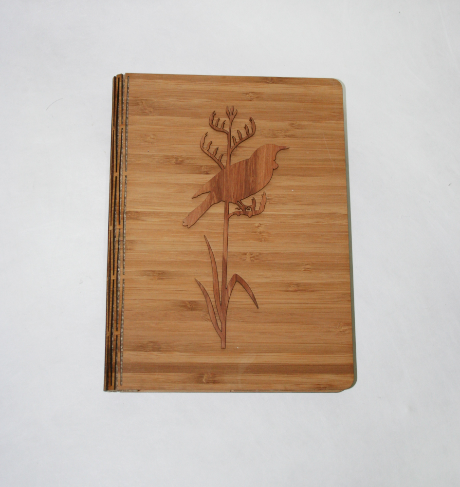 Elegant notebook featuring Tui on Tall Flax design, handcrafted from NZ Silver Beech & Bamboo Veneer, perfect for journaling.