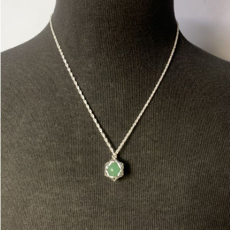 Aventurine star pendant symbolizing good luck and positivity, showcasing its enchanting green hue and elegant design.