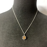 Tigers Eye Star Grounding Pendant featuring a star-shaped tigers eye gemstone known for its grounding and protective properties.